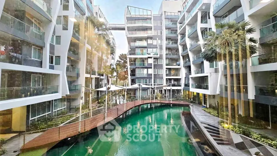 Luxurious modern apartment complex with stunning pool and lush landscaping