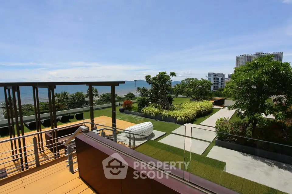 Luxurious rooftop terrace with stunning ocean view and lush greenery