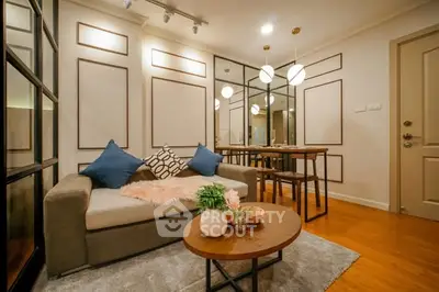 Stylish living room with modern decor and cozy seating area in a contemporary apartment.