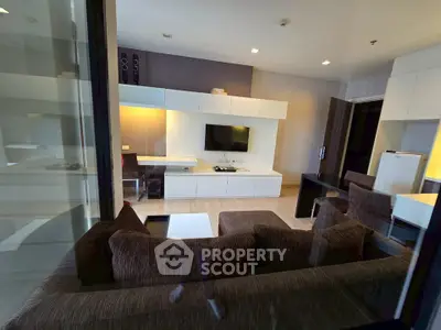 Modern living room with stylish furniture and built-in entertainment center