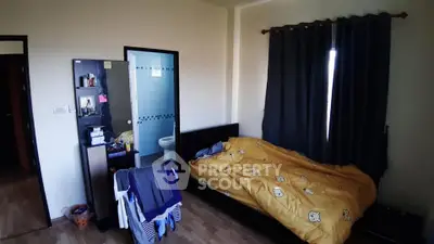 Cozy bedroom with attached bathroom and stylish decor