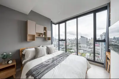 Modern bedroom with stunning city view and stylish decor