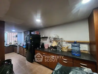 Spacious kitchen with modern appliances and ample storage in a cozy home setting.