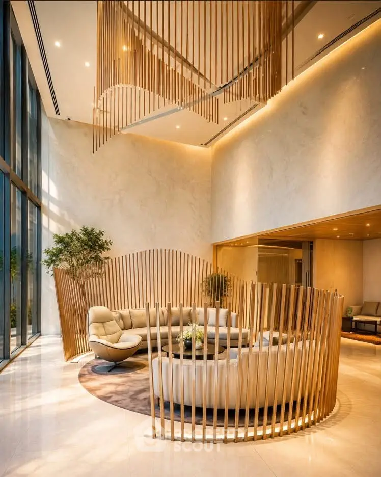 Luxurious modern lobby with elegant seating and high ceilings, featuring stylish wooden accents and natural lighting.