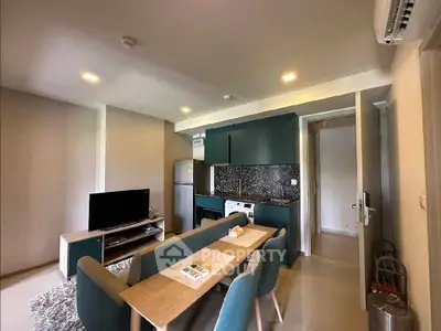 Modern living room with open kitchen and stylish dining area