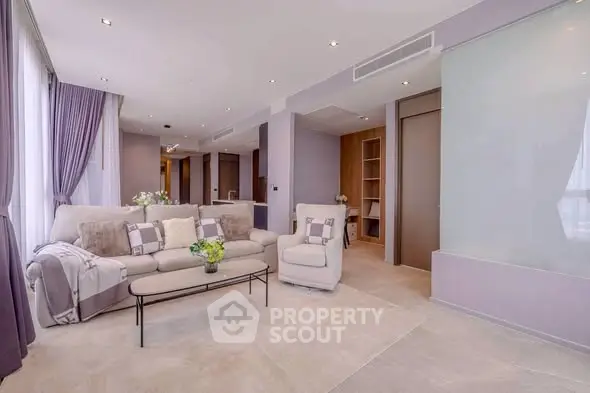 Luxurious modern living room with elegant decor and plush seating in a high-end apartment.