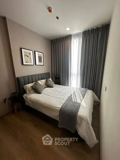 Cozy modern bedroom with stylish decor and natural light