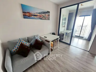 Modern living room with cozy sofa and balcony view