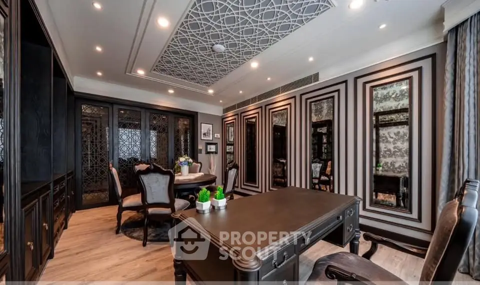 Luxurious home office with elegant decor and intricate ceiling design, perfect for productivity and style.