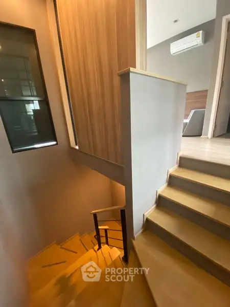 Modern staircase with wooden accents in a stylish home interior