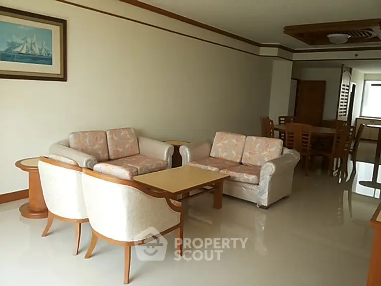 Spacious living room with elegant furniture and dining area in a modern home.