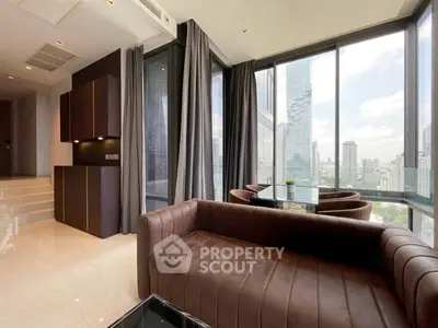 Luxurious modern living room with panoramic city views and elegant furnishings.