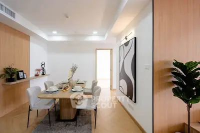 Modern dining room with elegant decor and stylish furniture in a contemporary apartment.