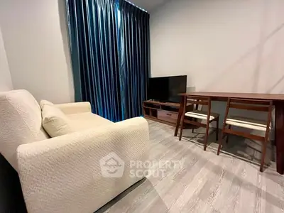 Cozy living room with modern furniture and elegant curtains