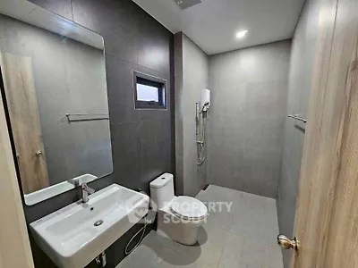 Modern minimalist bathroom with sleek fixtures and neutral tones