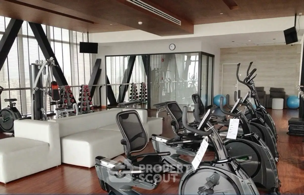 Luxurious gym with modern equipment and sleek design in upscale property.