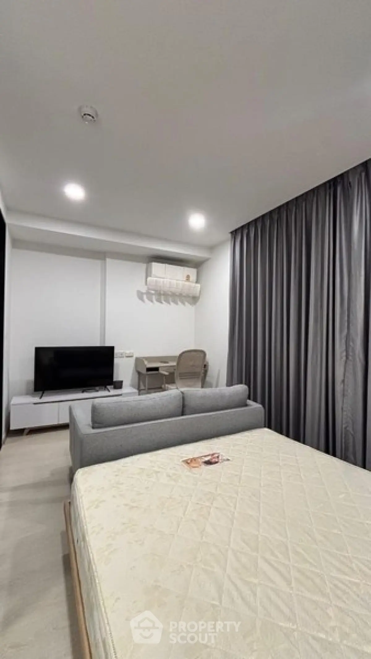 Modern studio apartment with cozy living area and stylish decor