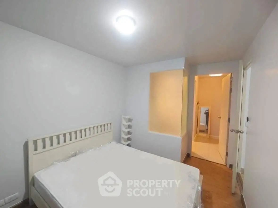 Cozy bedroom with minimalist design and soft lighting