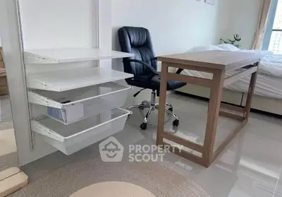 Modern study area with sleek desk and ergonomic chair in a bright room