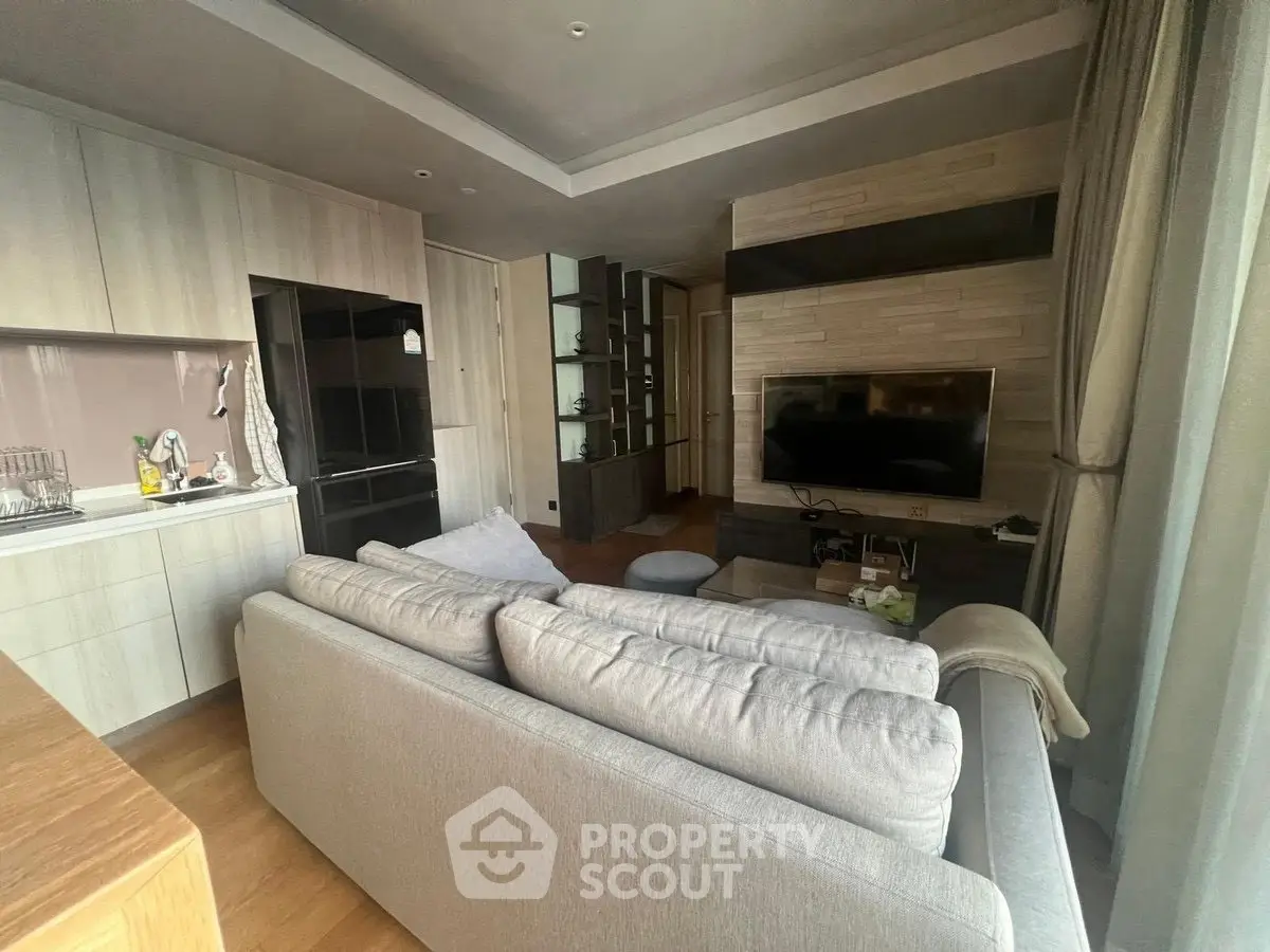 Modern living room with cozy sofa and sleek TV setup