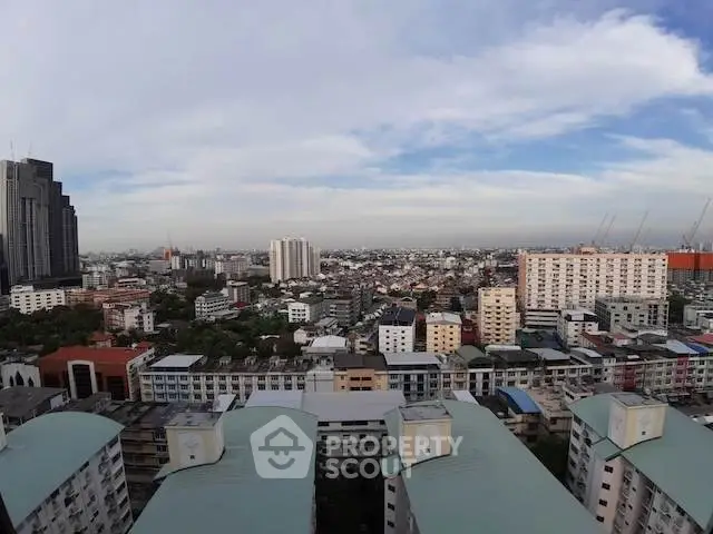 Stunning cityscape view from high-rise building showcasing urban skyline and residential architecture.