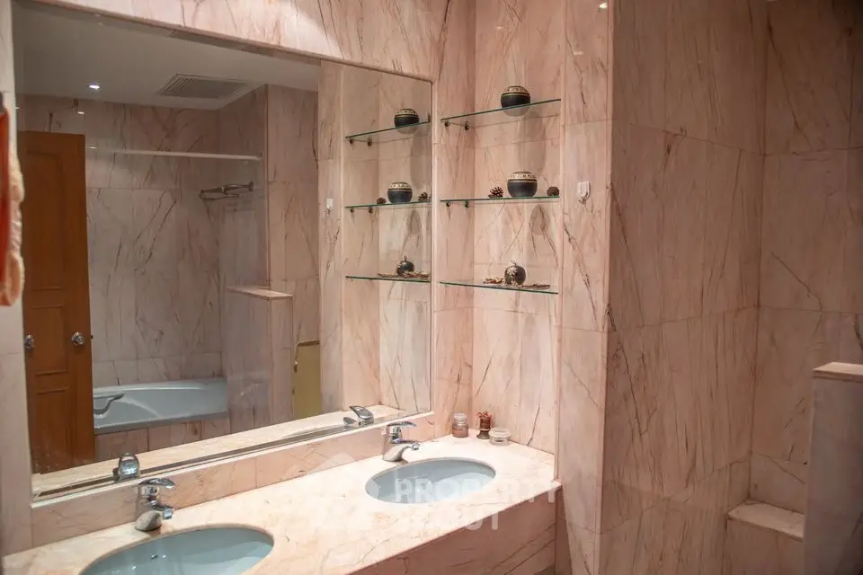 Luxurious marble bathroom with double sinks and elegant decor