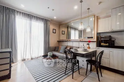 Chic modern living room with open kitchen, stylish decor, and ample natural light.