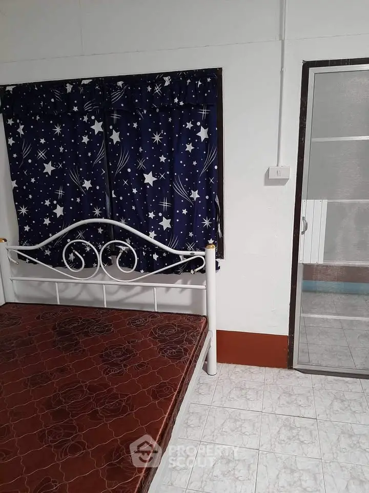 Cozy bedroom with starry curtains and simple decor