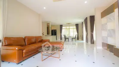 Spacious living room with elegant leather sofa and modern open layout