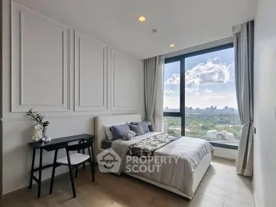 Luxurious bedroom with stunning city view and elegant decor