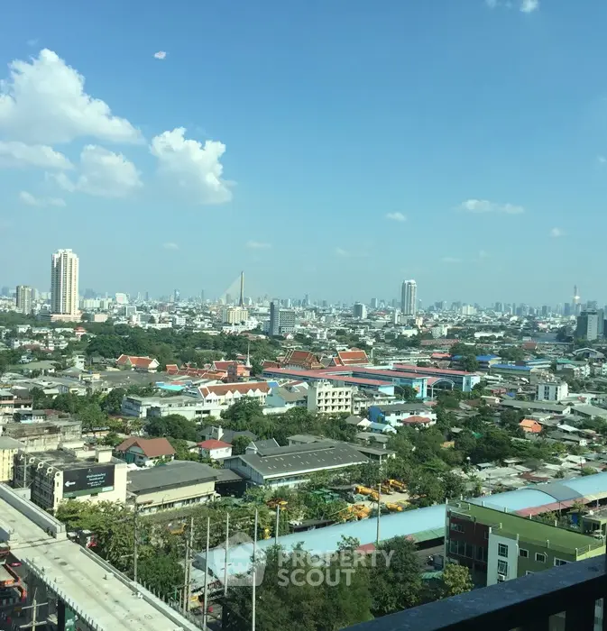 Stunning cityscape view from high-rise apartment balcony showcasing urban skyline.