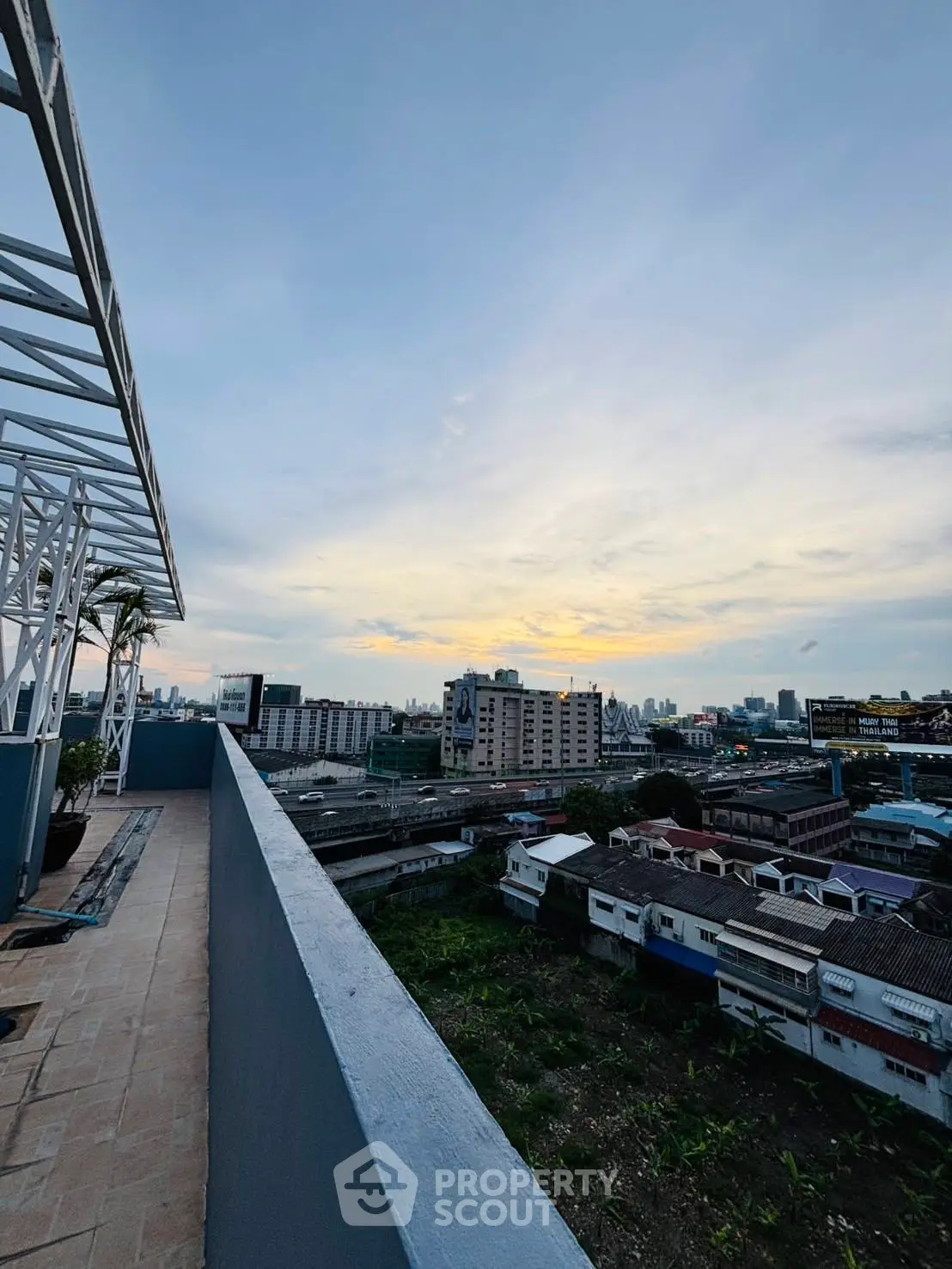 Stunning rooftop view of city skyline at sunset, perfect for urban living.