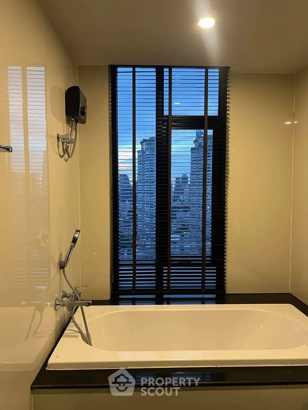 Luxurious bathroom with city view and modern bathtub