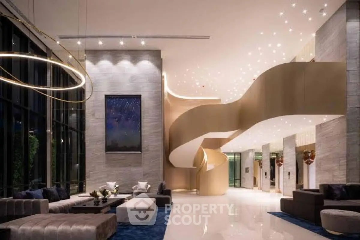 Luxurious modern lobby with elegant spiral staircase and stylish seating area