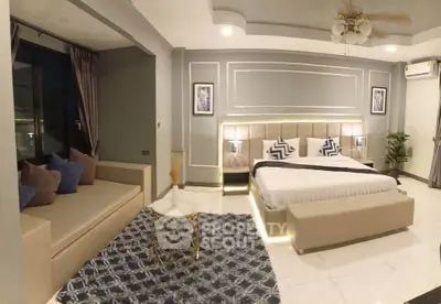 Luxurious bedroom with elegant decor and cozy seating area