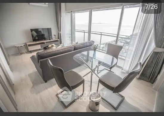 Modern living room with ocean view and sleek furniture
