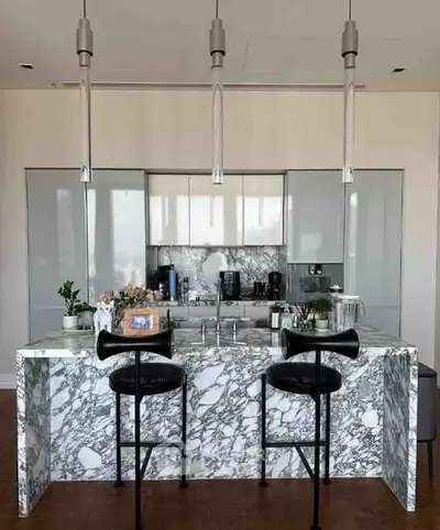 Luxurious modern kitchen with marble island and sleek appliances