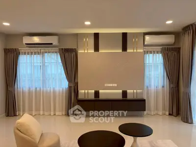 Modern living room with elegant curtains and air conditioning units