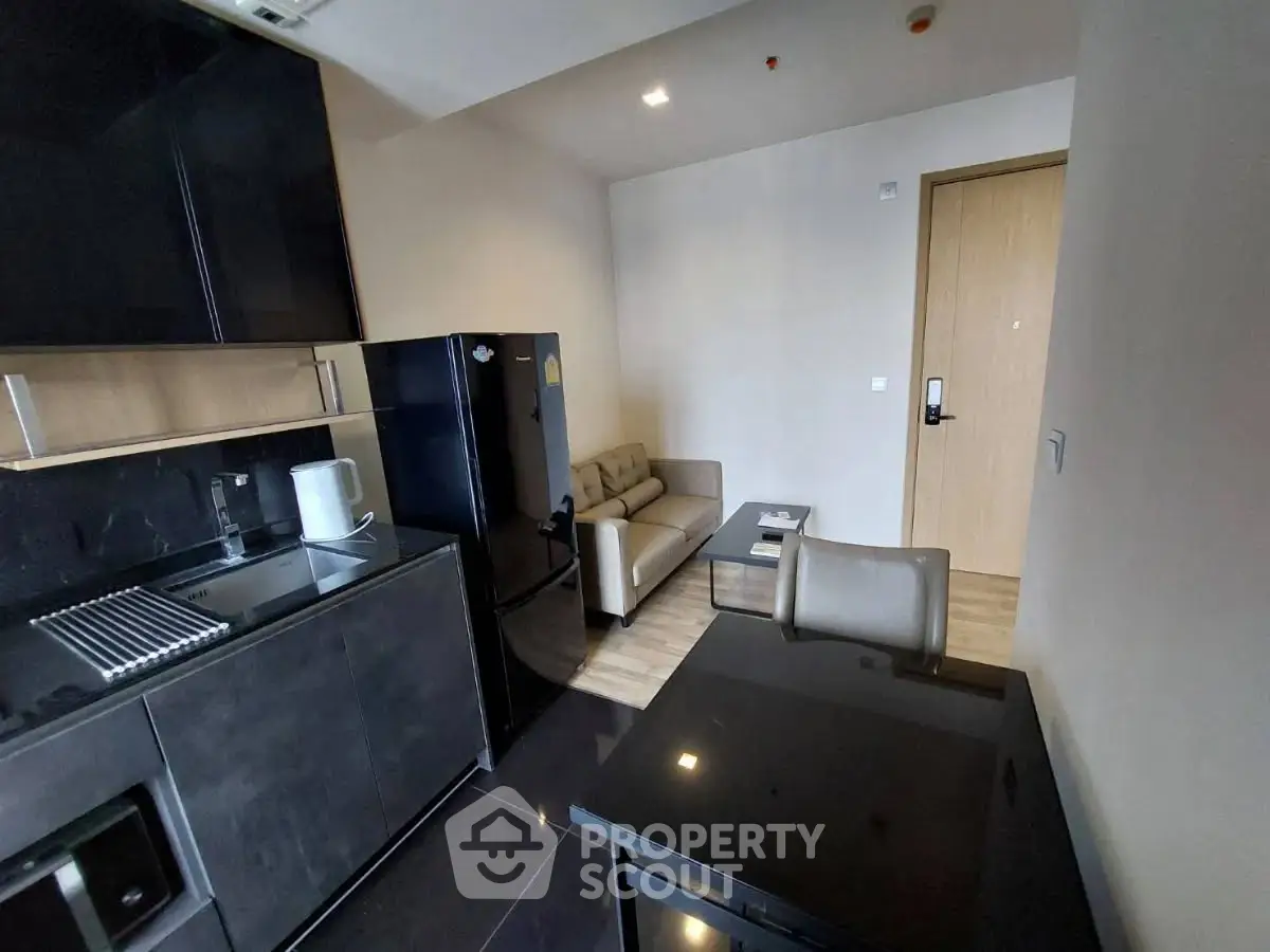 Modern apartment interior with sleek kitchen and cozy living area