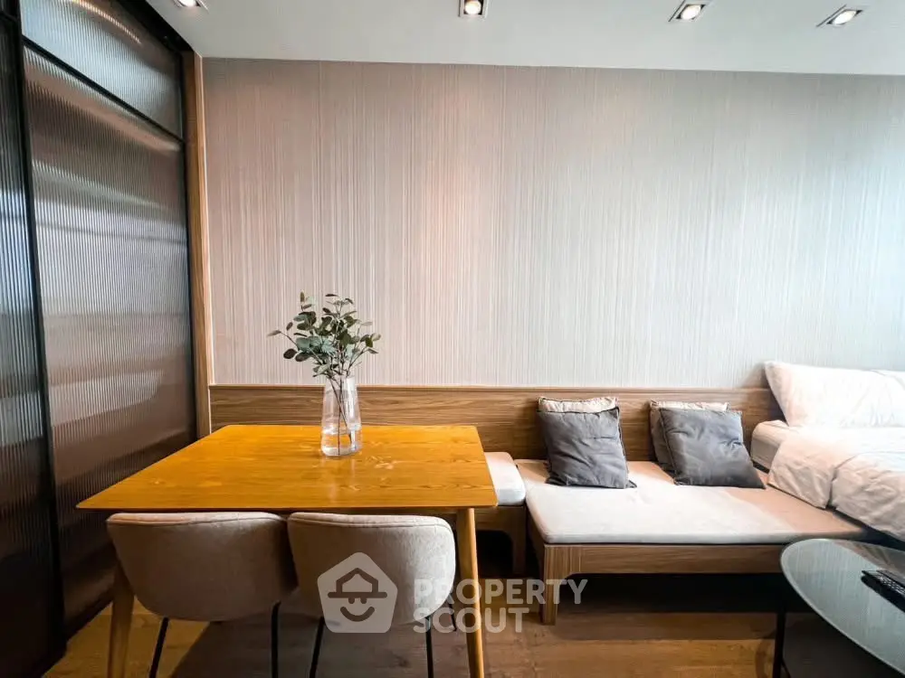 Modern living room with cozy seating and elegant dining area