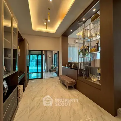 Luxurious modern living room with elegant decor and marble flooring, showcasing a sophisticated interior design.
