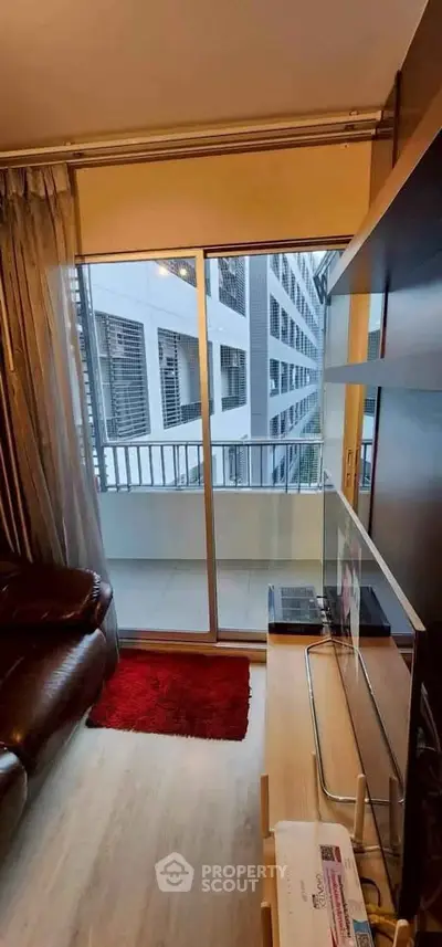 Modern living room with balcony view in urban apartment