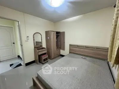 Cozy bedroom with modern furniture and ample storage space