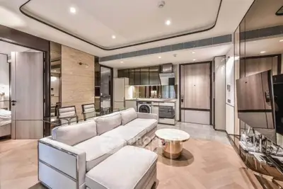 Luxurious modern living room with open kitchen and elegant furnishings