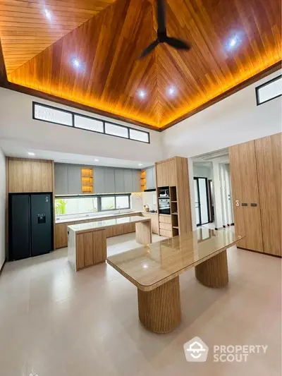 Luxurious modern kitchen with wooden ceiling and sleek design