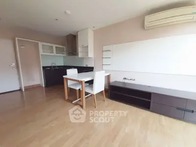 Modern open-plan living area with sleek kitchen and dining setup