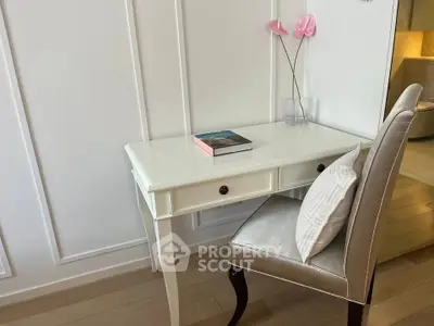 Elegant study nook with white desk and chair, perfect for a home office setup.