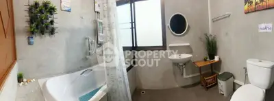 Modern bathroom with bathtub and stylish decor in contemporary home