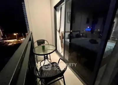 Cozy balcony with night view, perfect for relaxation and intimate gatherings.
