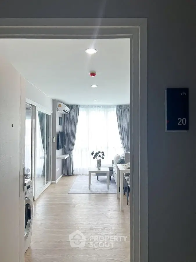 Modern living room with large windows and stylish decor